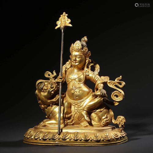 A GILT-BRONZE STATUE