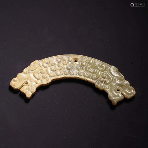 A WHITE JADE DRAGON PATTERN CARVED HUANG