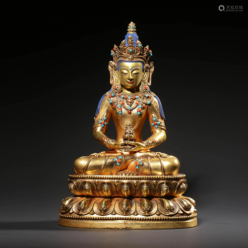 A GEM INLAID GILD BRONZE SEATED BUDDHA STATUE OF