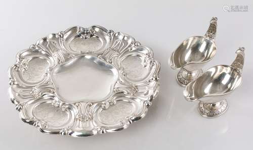 Two silver gravy boats