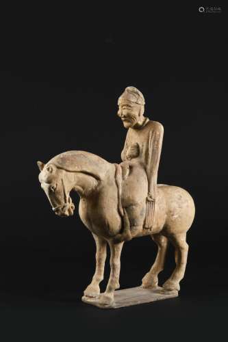 A CHINESE POTTERY FIGURE OF A HORSE AND RIDER