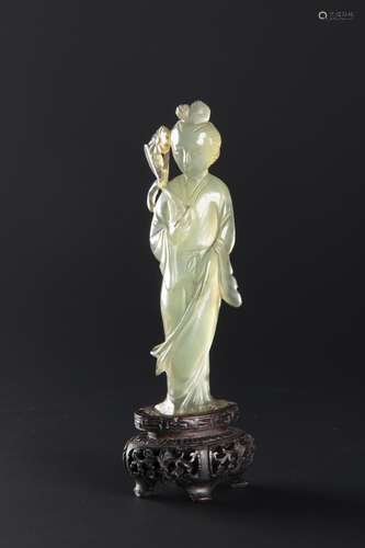 A PALE GREEN CHINESE JADEITE FIGURE OF HE XIANGU