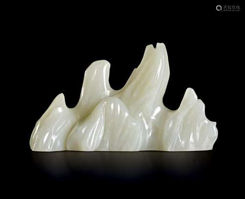 A CHINESE WHITE JADE 'MOUNTAIN' BRUSH REST