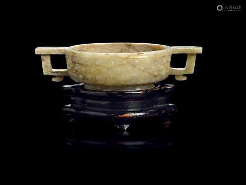 AN ARCHAISTIC CHINESE CHICKEN BONE JADE CUP WITH HANDLES