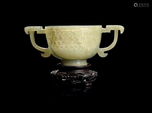 A CHINESE GREENISH-GREY JADE CUP WITH HANDLES