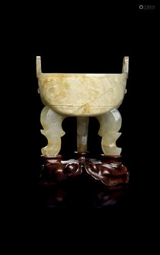 A CHINESE SEMI-TRANSLUCENT CELADON JADE CUP IN THE FORM OF A...