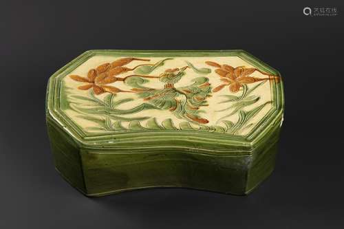 A CHINESE CREAM, OCHRE, AND GREEN-GLAZED 'PHOENIX' PILLOW