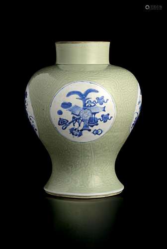 A CARVED CELADON GLAZED UNDERGLAZE BLUE BALUSTER VASE