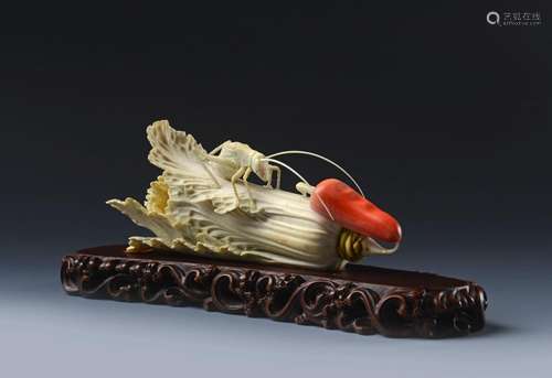 A FINE IVORY CABBAGE LEAF WITH CRICKET AND RED PEPPER