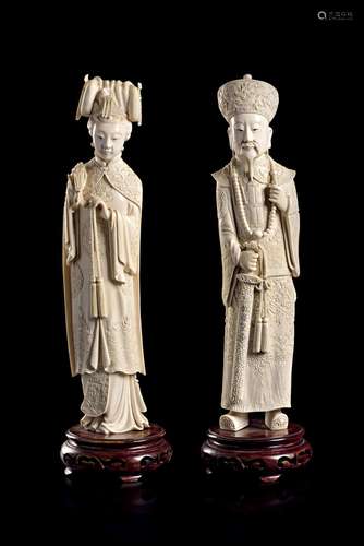 A PAIR OF CARVED IVORY EMPEROR AND EMPRESS FIGURES