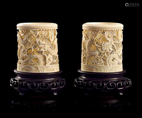 A PAIR OF CARVED IVORY RETICULATED 'DRAGON' BRUSH POTS