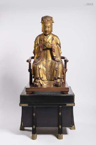 A GILT-LACQUERED WOOD FIGURE OF A SEATED DEITY