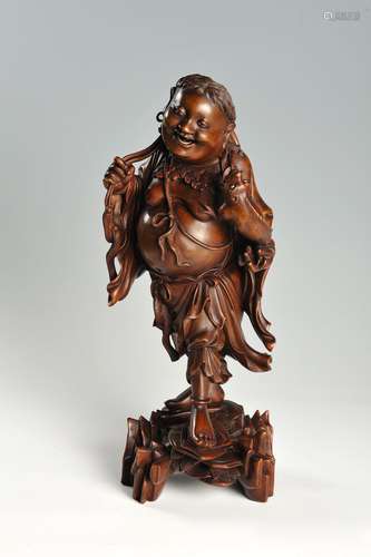 A FINELY CARVED WOOD FIGURE OF LIU HAI