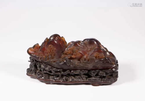 AN AMBER CARVED