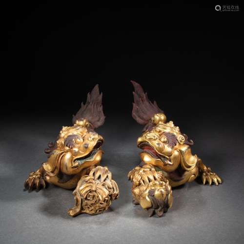 A PAIR OF GILT BRONZE LIONS, QING DYNASTY, CHINA