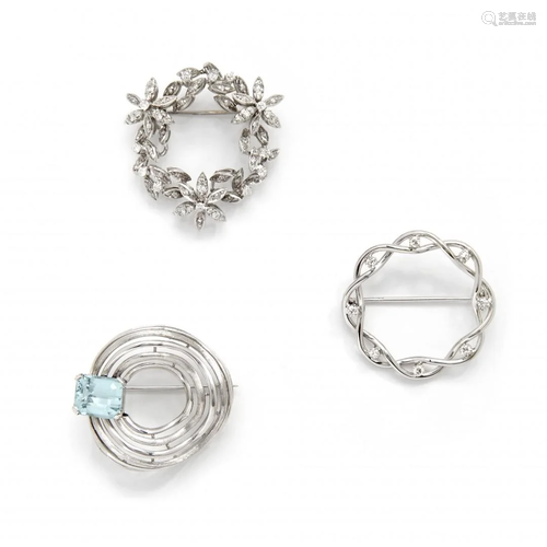 three diamond and aquamarine brooches