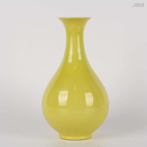 A yellow-glazed pear-shaped vase