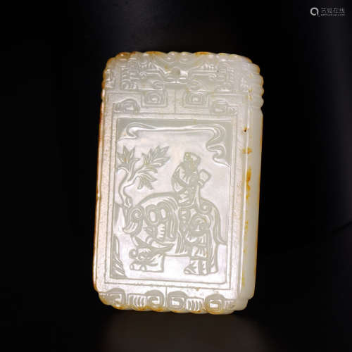A carved hetian jade boy and elephant plaque