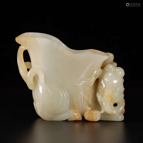 A carved hetian jade figure cup