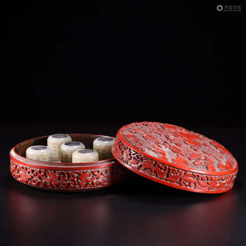 A hetian jade inscribed fingerstalls with lacquer box and co...