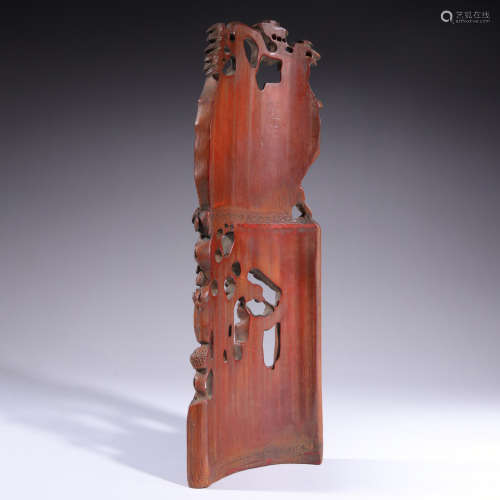 a carved bamboo arm rest