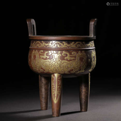 A gilt bronze taotie tripod incense burner