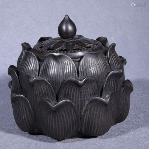 a sandalwood lotus-shaped incense burner