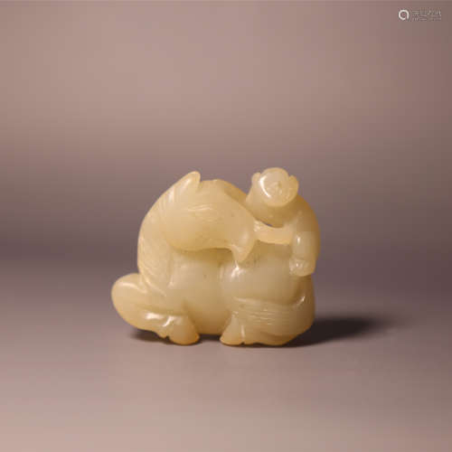 A carved white jade horse and figure
