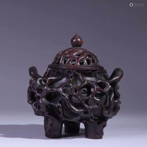 A sandalwood interlocking flowers incense burner