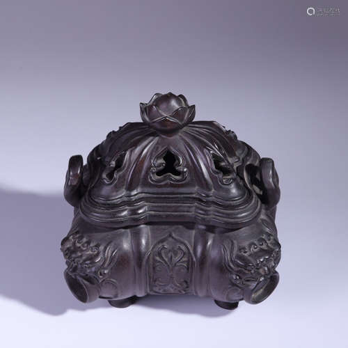 A sandalwood lion incense burner