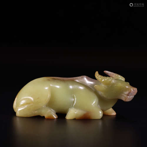 A carved yellow jade ox ornament