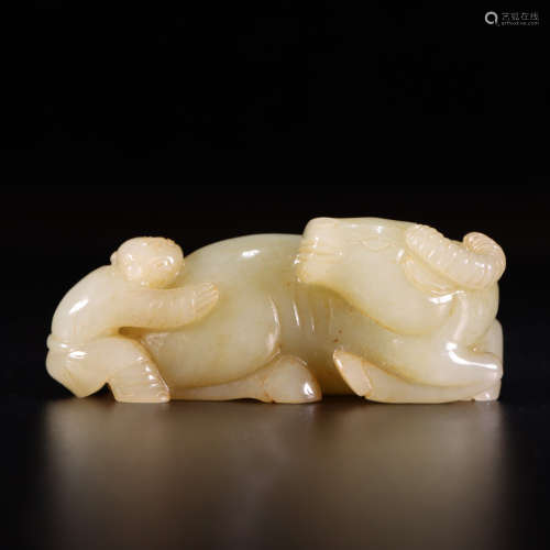 A carved hetian jade ox and child ornament