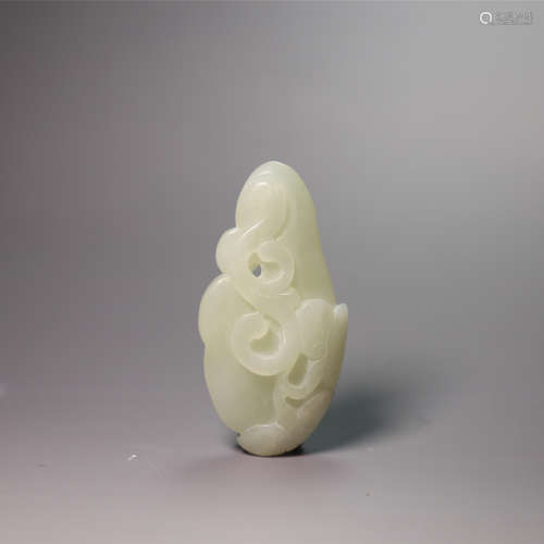 A carved white jade ruyi