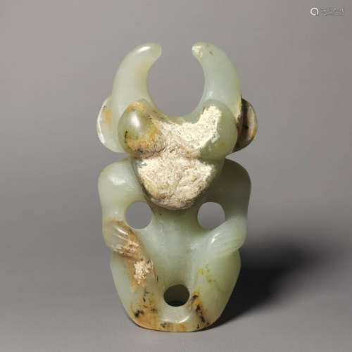 A carved gray jade witch