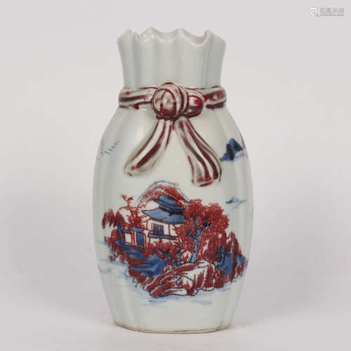 An unglazed blue and white landscape vase