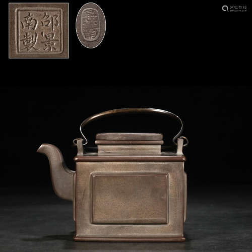 A bronze square teapot