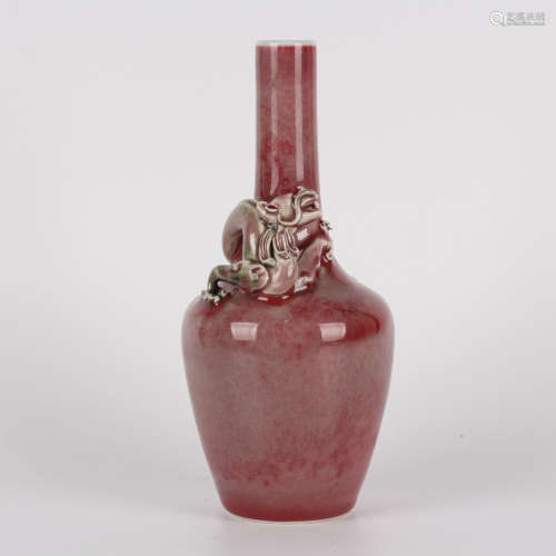 A red-glazed dragon bottle vase