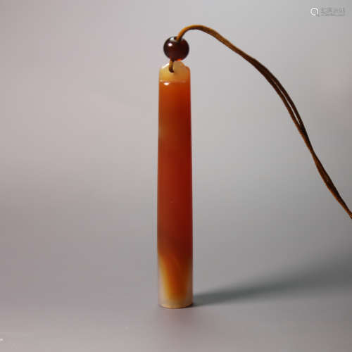 A carved jade tube