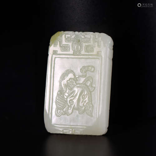 A carved hetian jade lion playing plaque
