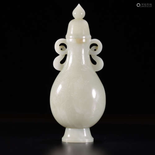 A carved hetian jade cranes and pine vase and cover