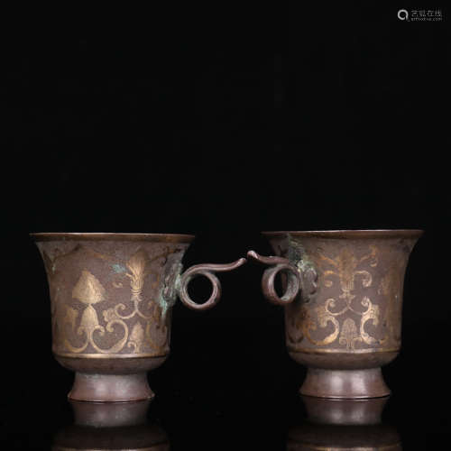 A pair of gold-inlaid sterling silver interlocking flowers c...