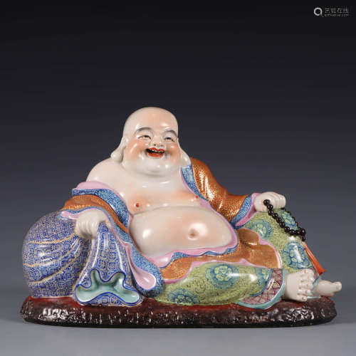 A Famille rose seated statue of Maitreya