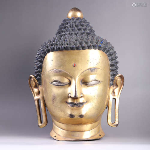 A Gilt Bronze head of Shakymuni
