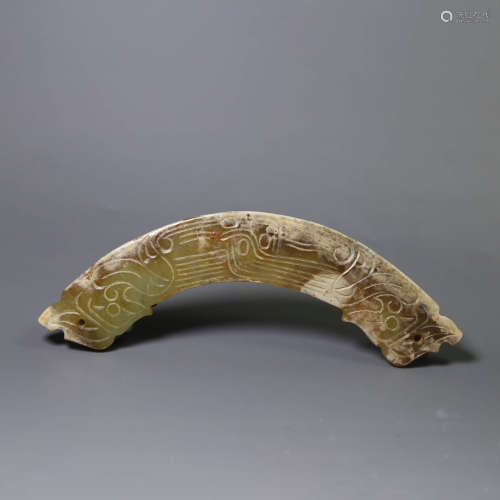 A carved jade huang