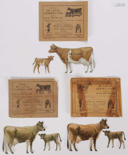 THREE SETS DELAVAL TIN ADVERTISING COWS