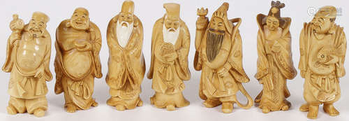 A SET OF SEVEN CARVED IVORY LUCK GODS