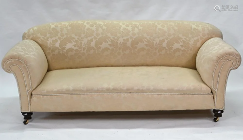 A traditional scroll arm Chesterfield sofa