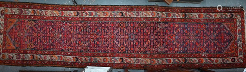 An antique Persian Hamadan runner, 420 cm x 105 cm