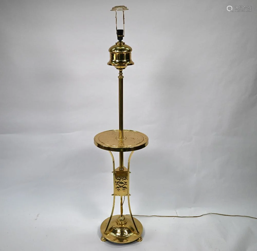 An Arts & Crafts style brass standard lamp with