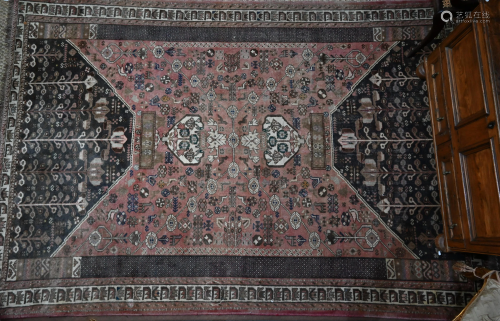 A large Persian carpet, geometric designs, washed faded